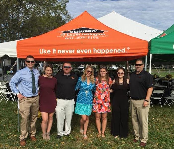 Tents and marketing staff at event